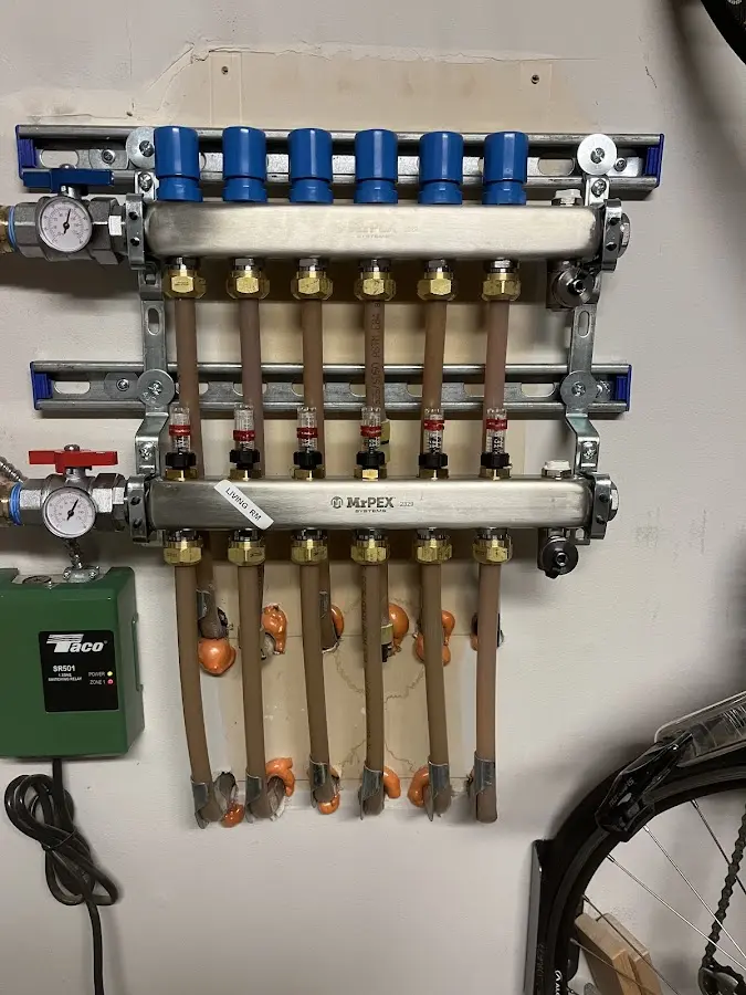 Plumber performing Water Heater Repair at a residential property in Ashland